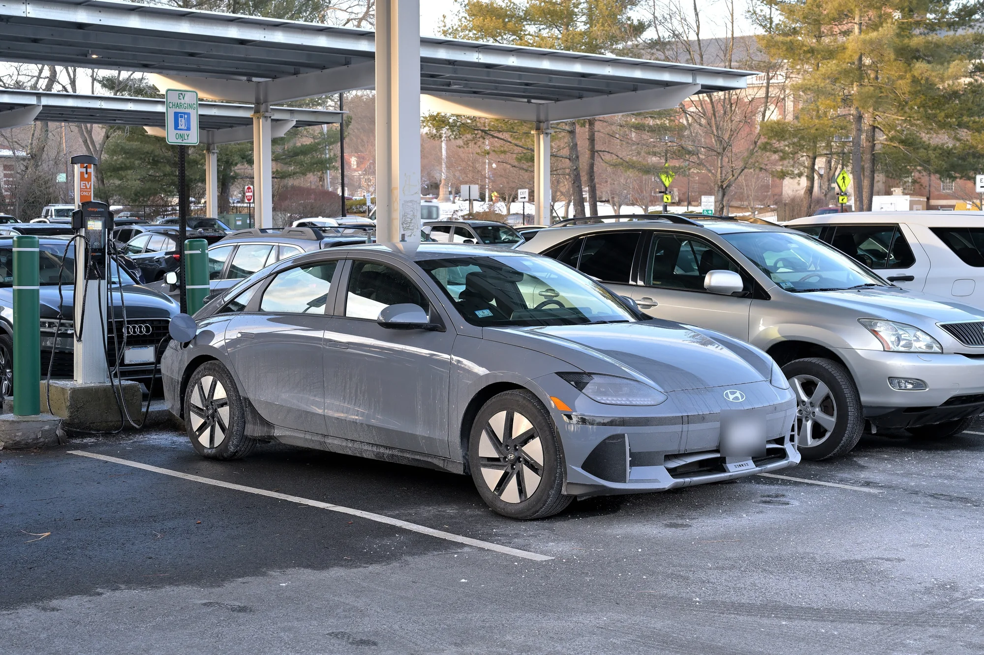 Hyundai IONIQ 6 electric sedan at a public charging station