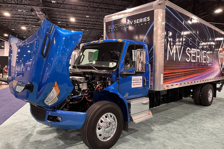 Blue medium-duty box truck with a white dry freight box