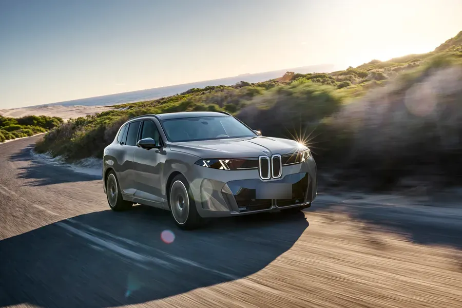 BMW iX5 on a coastal road